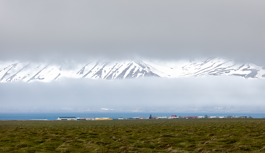 Árskógssandur and Eyjafjörður mountains in fog, Iceland