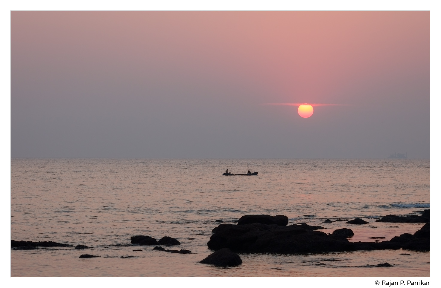 Fishermen at sunset in Odxel, Goa