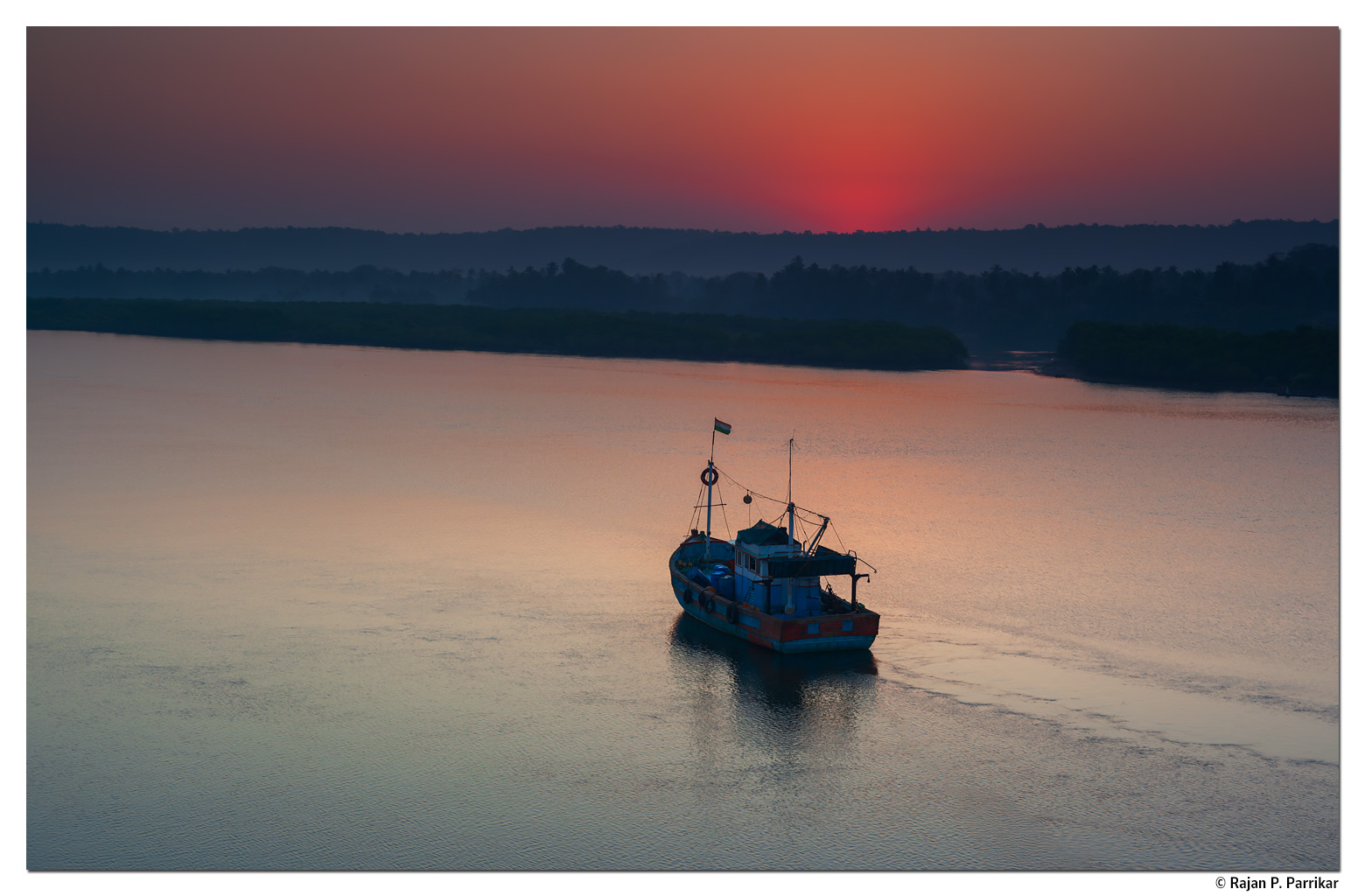 Sunrise in Siolim over Chapora river